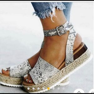 Black, silver, and white platform sandals